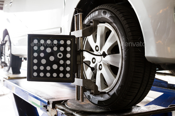 Wheel alignment of a vehicle in progress