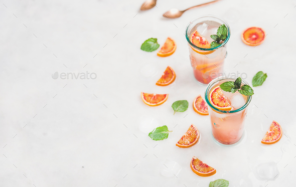 Blood orange fresh summer lemonade in glasses, copy space - Stock Photo - Images