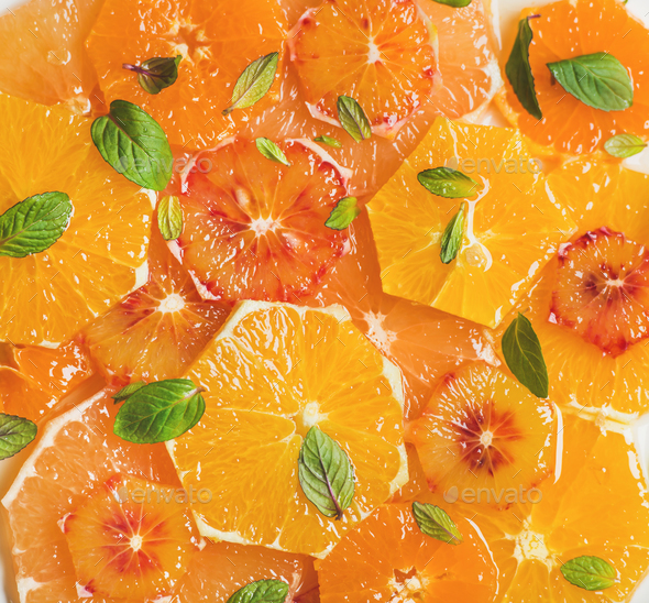 Fresh citrus fruit salad with mint and honey, close-up - Stock Photo - Images