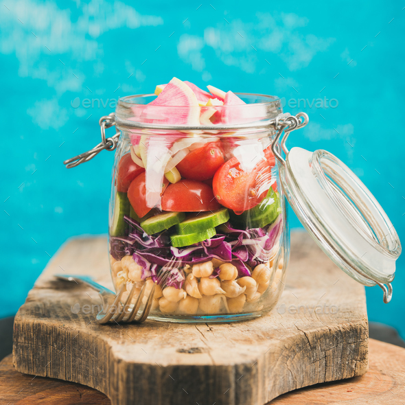 Vegetable and chickpea sprout vegan salad in jar, square crop - Stock Photo - Images