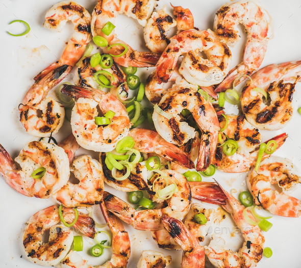 Close-up of grilled tiger prawns over white background - Stock Photo - Images