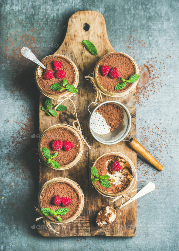 Homemade dessert Tiramisu in glasses on wooden board - Stock Photo - Images