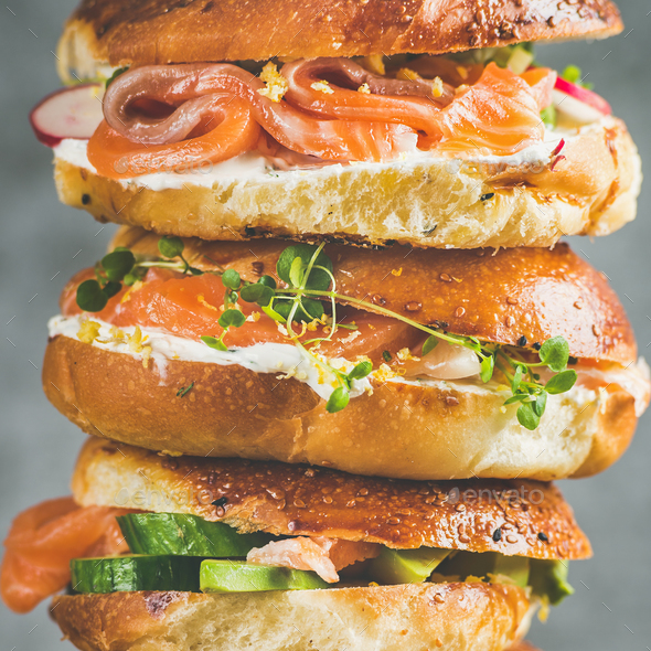 Close-up of Bagels with salmon, eggs, vegetables, capers, cream-cheese, herbs - Stock Photo - Images
