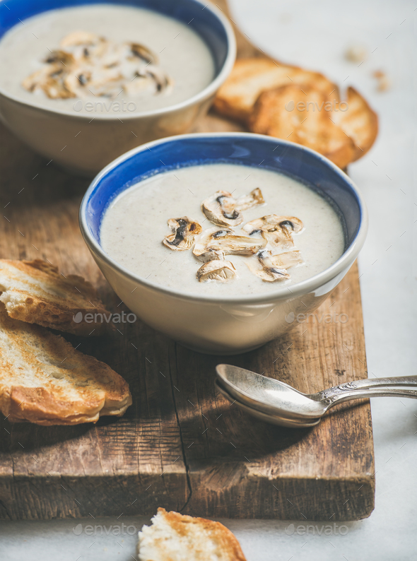 Healthy dinner with creamy mushroom soup and grilled bread - Stock Photo - Images
