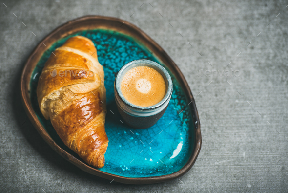 Cup of espresso coffee and croissant in tray, copy space - Stock Photo - Images