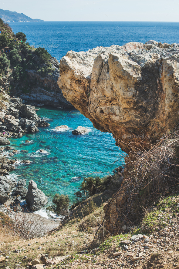 Rock over chasm and beautiful natural lagoon down, Turkey - Stock Photo - Images