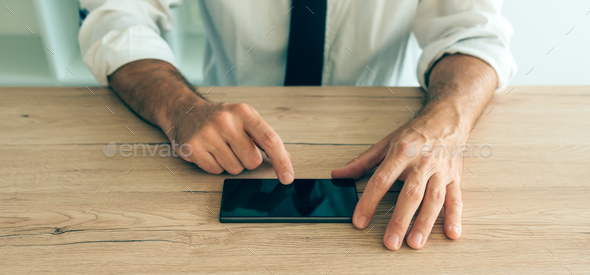 Smartphone in hands of successful businessman - Stock Photo - Images