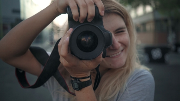 Young Smiling Girl with Camera