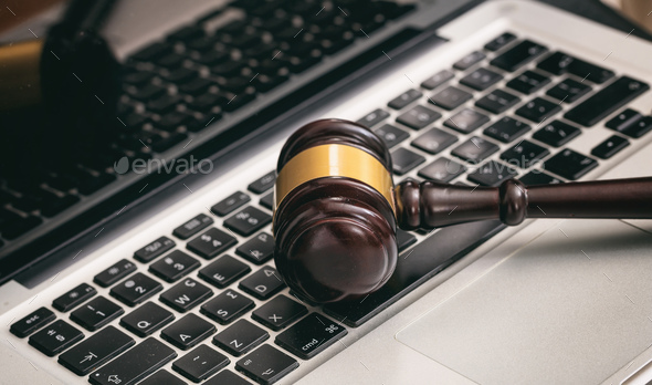 Auction or Judge gavel on a laptop - Stock Photo - Images