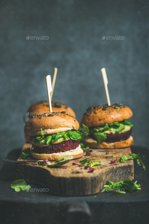 Healthy vegan burger with beetroot-quinoa patty and arugula leaves - Stock Photo - Images