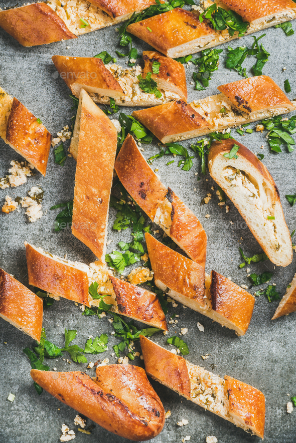 Slices of chopped turkish pizza pide with cheese and spinach - Stock Photo - Images