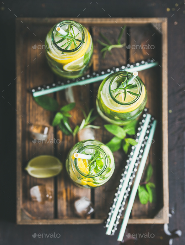 Citrus and herbs infused sassi water in wooden tray - Stock Photo - Images
