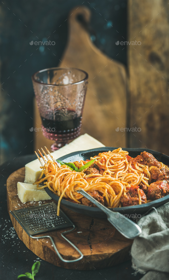 Italian pasta dinner with spaghetti, meatballs and red wine - Stock Photo - Images