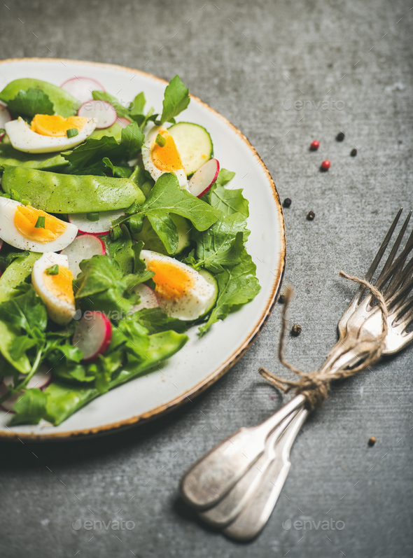 Healthy spring green salad with vegetables, pea and boiled egg - Stock Photo - Images