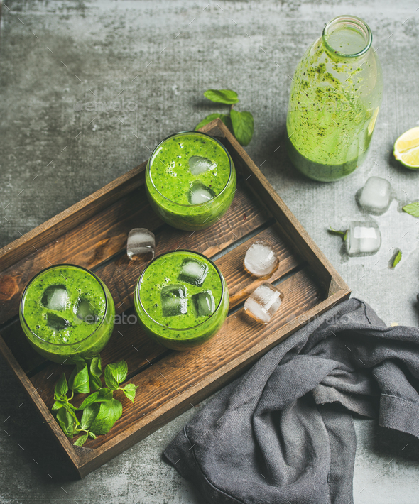 Fresh smoothie with ice cubes, mint and lime, copy space - Stock Photo - Images