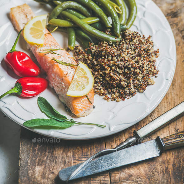 Roasted salmon with quinoa, chilli pepper and poached beans - Stock Photo - Images