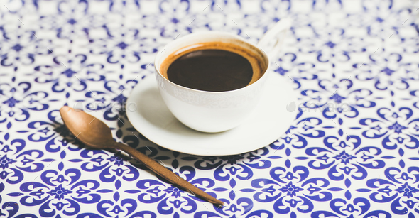 Cup of black Turkish or Eastern style coffee, selective focus