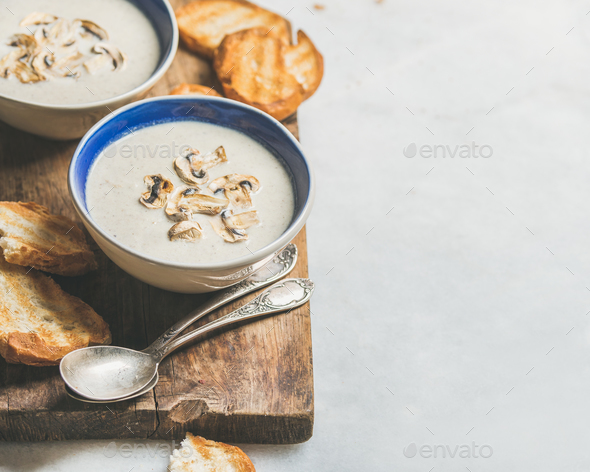 Healthy dinner with creamy mushroom soup and bread, copy space - Stock Photo - Images