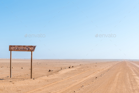 Turn-off from C34-road to rusted oil drilling rig - Stock Photo - Images