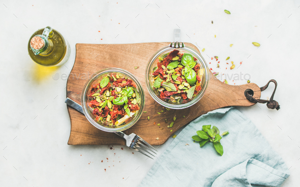 Healthy vegan salad with quionoa, avocado, dried tomatoes, top view - Stock Photo - Images