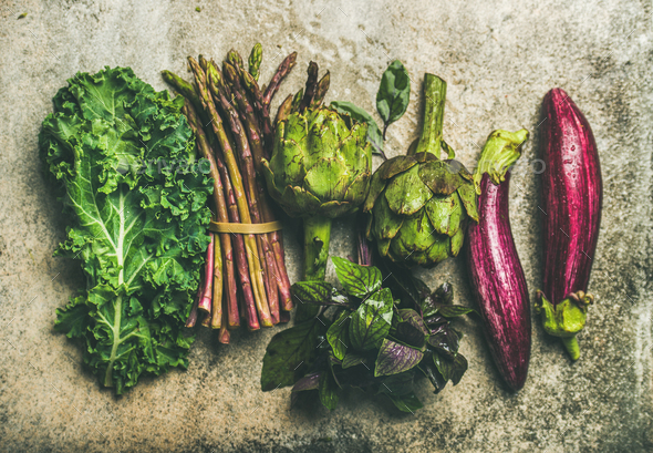 Flat-lay of fresh green and purple vegetables, top view - Stock Photo - Images
