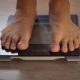 Man Measuring Weight with Health Scale. Closeup Legs - VideoHive Item for Sale
