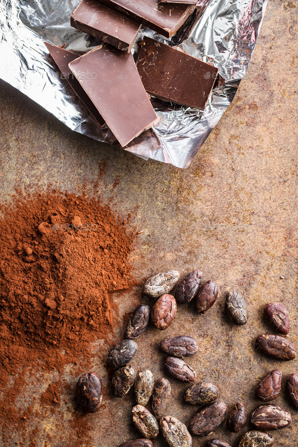 Dark cocoa powder, cocoa beans and chocolate.