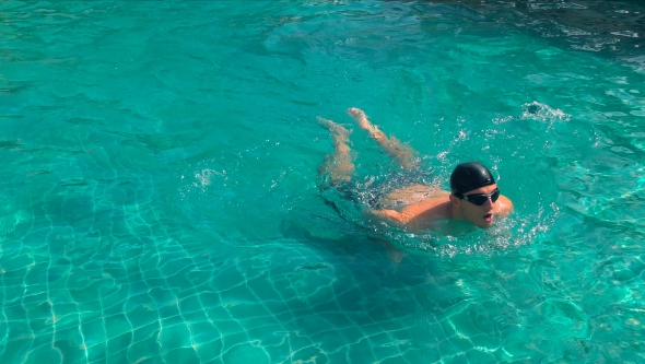 Man Swimming in the Pool