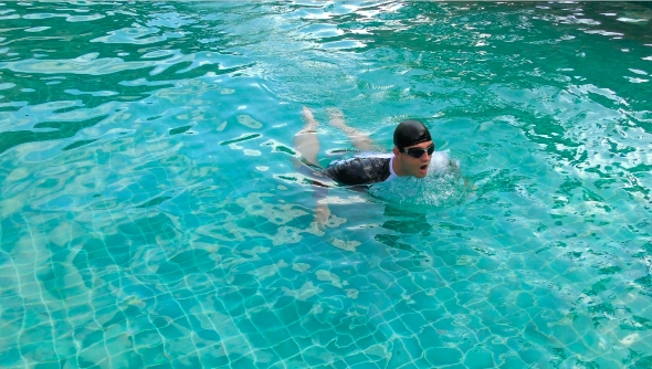 Man Swimming in the Pool