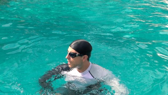 Man Swimming in the Pool