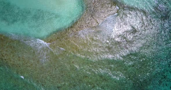 Natural Flying Copy Space Shot of A White Sandy Paradise Beach and Aqua Blue Water Background alt