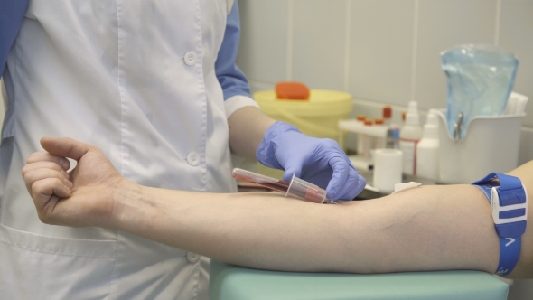 Nurse Takes Blood Samples From Patient alt