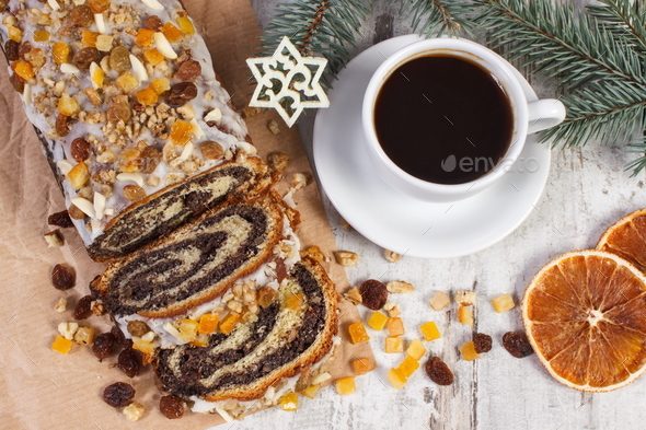 Poppy seeds cake, cup of coffee and spruce branches, dessert and decoration for Christmas time