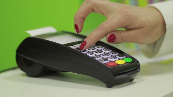Hand Using Bank Terminal for Credit Card Payment alt