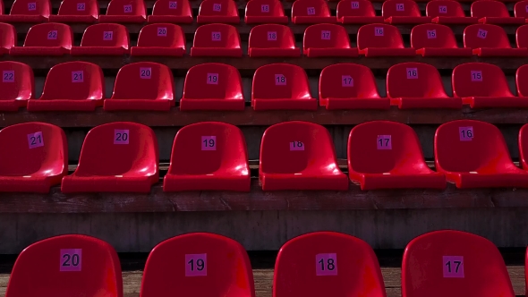 Rows of Red Plastic Seats at the Stadium