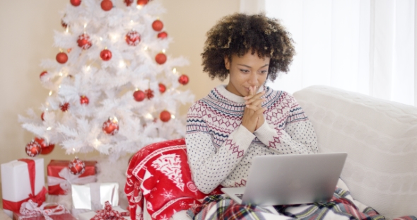 Happy Excited Woman Reading a Christmas Message alt