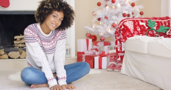 Pretty Young Woman in Christmas Living Room