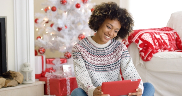 Young Woman Surfing the Internet at Christmas