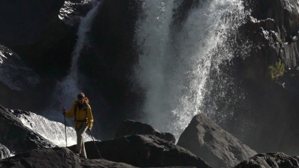 A Male Hiker Walks at a Waterfall in .
