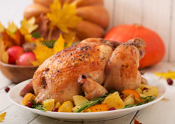 Roasted turkey garnished with cranberries on a rustic style - Stock Photo - Images