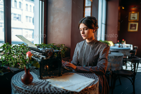 Portrait of beautiful young retro lady in cafe - Stock Photo - Images