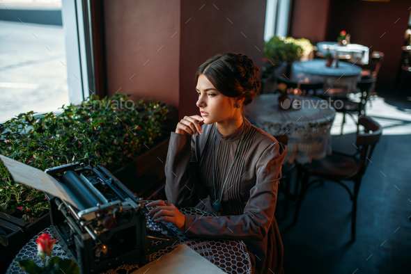 Portrait of beautiful young woman in cafe - Stock Photo - Images
