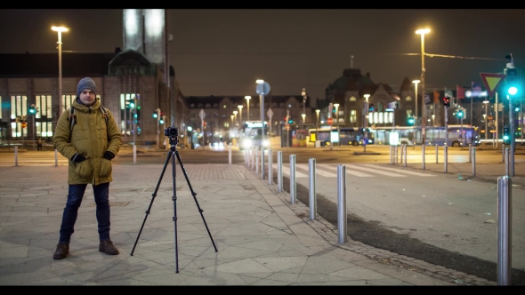 Night Street with Man Shooting Video. Helsinki, Finland alt