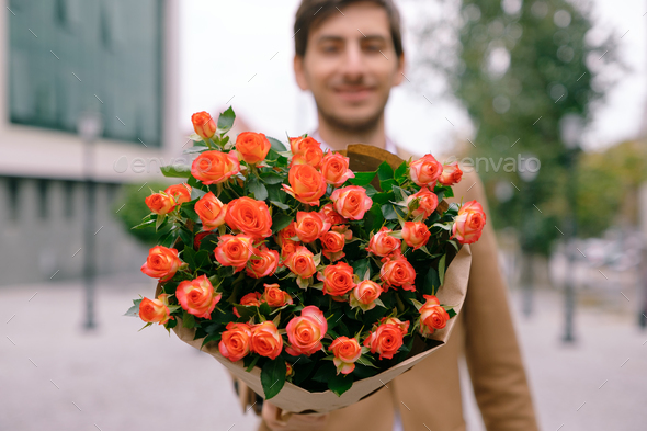 Flower delivery concept. Focus on bouquet of flowers
