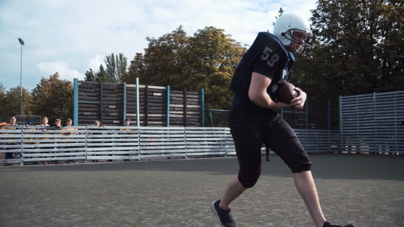 Two Men Training American Football on Field alt