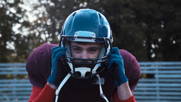 American Football Players Preparing Helmets alt