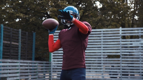 American Football Player Throwing Ball alt