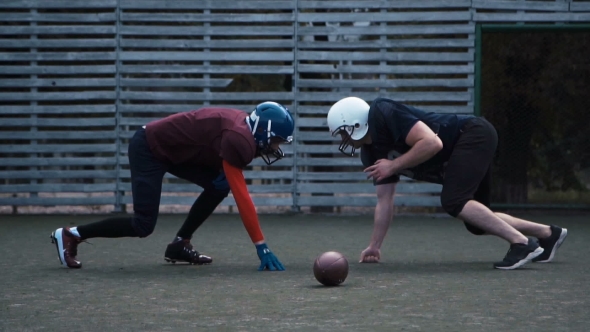Two Helmeted Football Players alt