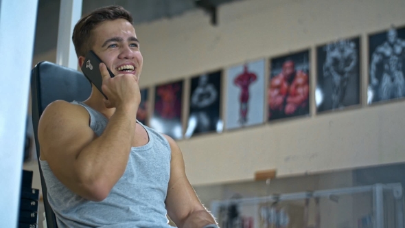 Young Man with Smartphone in Gym Call Friends