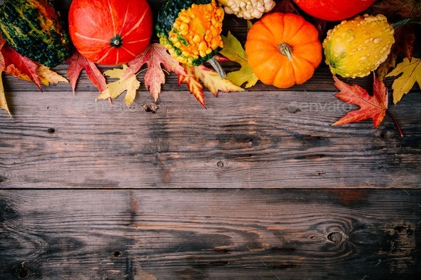 Colorful pumpkins and fall leaves on wooden background. Top view Stock ...